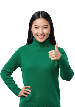 medium portrait of a young asian woman wearing a vibrant emerald green turtleneck, confidently giving a thumbs-up against high-key white studio light. Concept of positive affirmation and success
