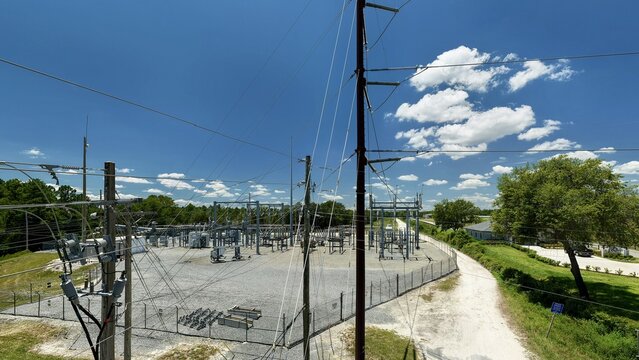 Aerial view of the Georgia-Pacific Palatka Operations facility, featuring electrical infrastructure, power lines, and greenery under a bright blue sky in Palatka, Florida, United States.