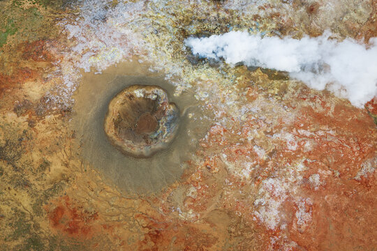 Aerial view of Gunnuhver geothermal area with its steaming vents and colorful mineral deposits in the volcanic landscape of Grindavikurbaer, Iceland.
