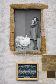 Osnabruck, Germany. Memorial relief to children killed in World War II. The relief was created in 2008 by Heinrich and Jakob Brummack. It is located on the side wall of the Dominican Church.