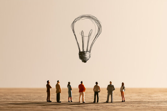 Multiple Tiny Miniature Figures Looking Up at Large Hand-drawn Light Bulb