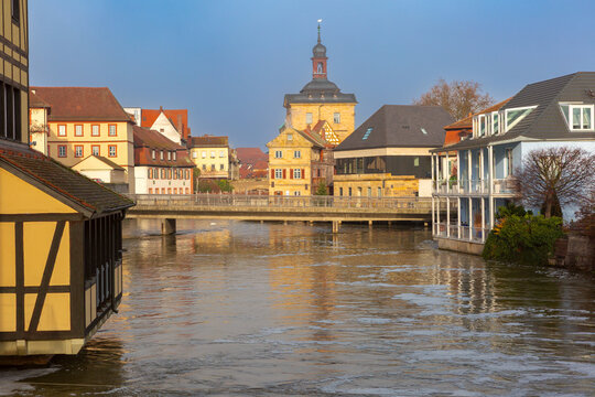 View of the historic City Hall, traditional buildings and the Regnitz River in the center of Bamberg, Bavaria, Germany.