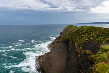 Scenic view of Cabo Mayor cliffs in Santander, Spain, with the sea and cloudy sky. © jjfarq