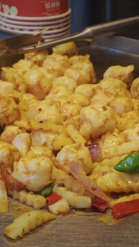 Chengdu, Sichuan, China. Fried Squid With Onions And Vegetables. Traditional Chinese Meat Snacks. Chinese Street Food. Street Barbecue. Asian Street Food. Asian Cuisine