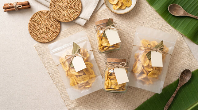 Banana chips in unbranded retail pouches and glass jars arranged as a tropical packaging mockup.