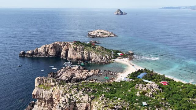 An aerial view of Yen Island, Hon Noi, Nha Trang, Khanh Hoa. This is a famous eco-tourism area in Nha Trang Bay, about 25km from Cau Da port, boasting a unique double beach and a natural swallows' cav