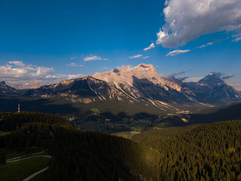 Dolomites mountain range peaks over alpine forest valley wilderness exploration