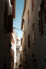 Fototapeta premium Historic old town street and traditional stone architecture in Krk town, Croatia