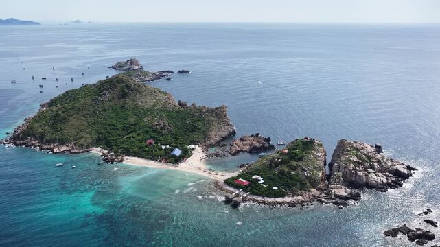 An aerial view of Yen Island, Hon Noi, Nha Trang, Khanh Hoa. This is a famous eco-tourism area in Nha Trang Bay, about 25km from Cau Da port, boasting a unique double beach and a natural swallows' cav