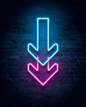 Neon arrow symbols pointing downwards glowing on brick wall background with direction electricity background illumination