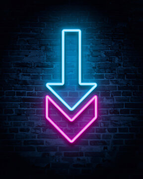 Dual colored neon down arrow sign on textured dark brick wall with direction background electric abstract technology
