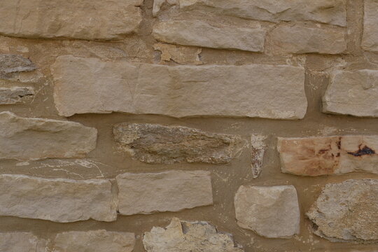 Rustic Beige Tan Stone Wall Texture Background - Abstract Natural Wallpaper for Interior Design Architecture Construction Projects