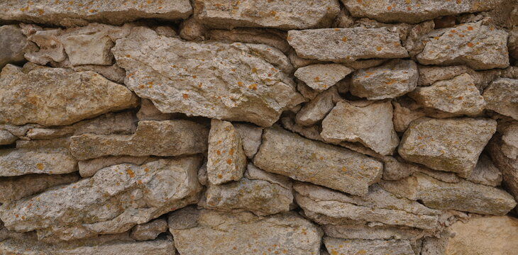 Earthy Tones Abstract Dry Stone Wall Texture Background Wallpaper for Architectural Concepts and Graphic Design