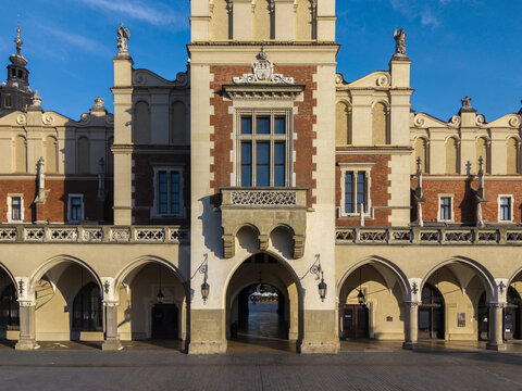 Aerial view of the historic Sukiennice Cloth Hall featuring ornate Renaissance architecture, arched loggias, and brick facade in Krakow, Wojewodztwo malopolskie, Poland.