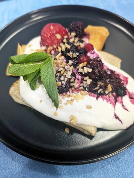 Indulgent Berry Crepes with Creamy Topping