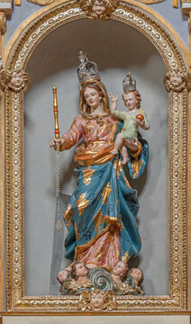 CREMA, ITALY - MARCH 20, 2026: The carved polychrome statue of Madonna (Help of christians) the church Chiesa di San Benedetto by school of Giacomo Bertesi end of 17. and beginn of 18. cent. )