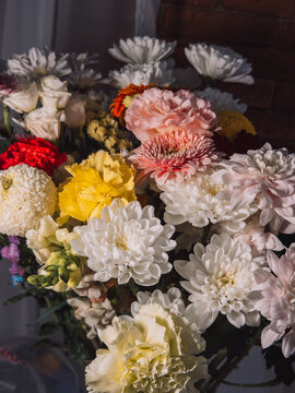 Colorful floral bouquet with white chrysanthemums, roses and gerbera flowers.