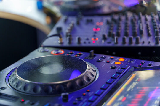 Professional DJ mixing console and media player setup