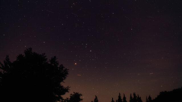 Summer Milky Way stars and landscape scenery silhouettes.