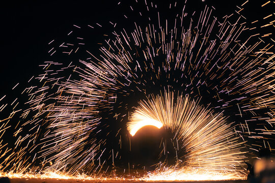 Swing fire dancing show fire show on the beach in Thailand.
