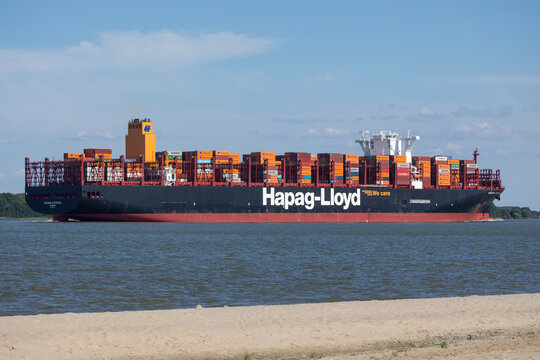 Stade, Germany &ndash; July 14, 2026: Container ship GDANSK EXPRESS, operated by German shipping company Hapag-Lloyd, sailing towards Hamburg on Elbe river.