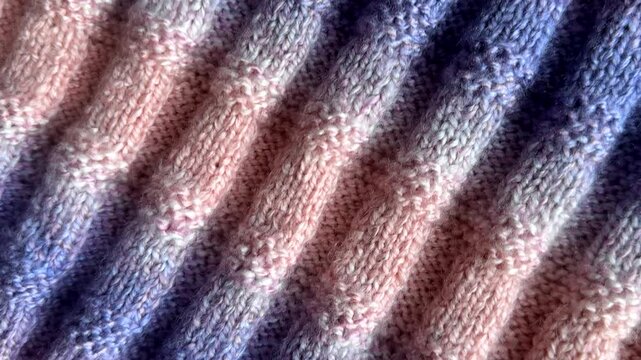 Multicoloured handmade knitted woollen woolen fabric background.