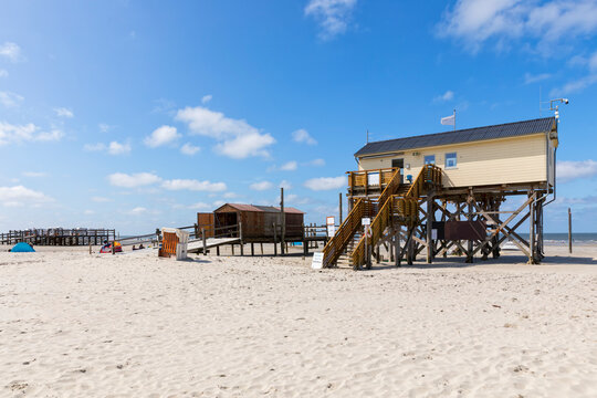 Lifeboat station and hooded beach chair rental at the beach of Sankt Peter-Ording, North Sea coast of Germany