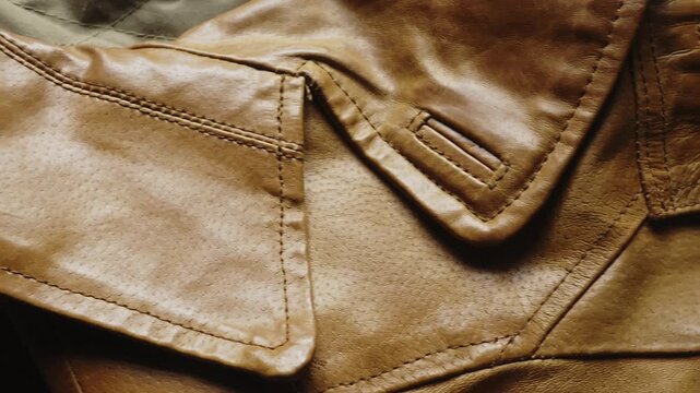 A detailed close-up slide reveals the exquisite craftsmanship and stitching on a designer leather jacket. Perfect for luxury fashion branding, apparel manufacturing, and style content.