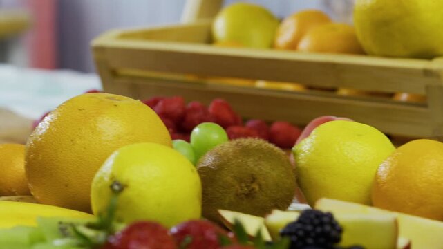 Closeup shot moving across various, delicious, fresh fruit in kitchen