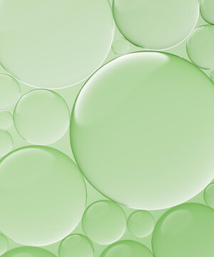 Three dimensional render of transparent glass spheres against green background