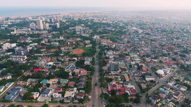 Aerial view of accra, ghana, showcasing city landscape development stretching to the atlantic ocean