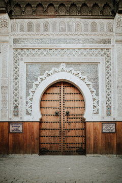 Traditional ornate wooden door with Islamic design in Marrakech