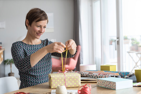 Woman wrapping gifts