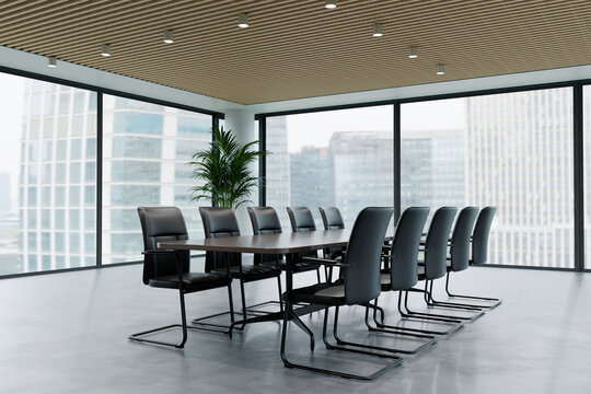 Modern conference room features a meeting table and black chair