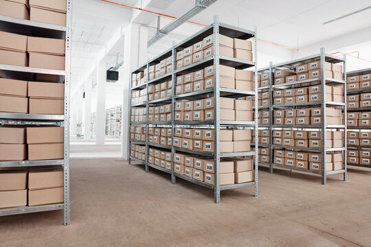 Cardboard boxes on shelves in a factory