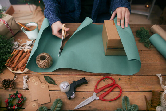Woman wrapping christmas gifts