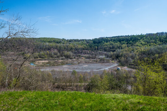 Germany, Hesse, Messel, Messel Pit quarry with forest in background