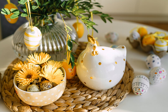 Easter eggs and decoration on table at home