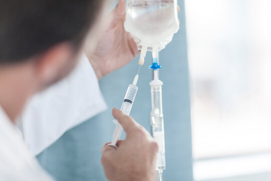 Doctor in hospital at IV drip
