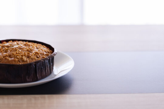 Fresh Baked Caramel Dessert on a Dinner Table. Closeup, selective focus.