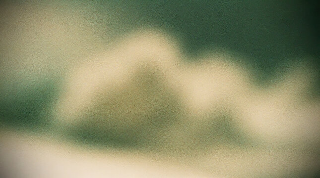 Mountain peak emerging through soft blur against a green natural background in muted atmospheric light
