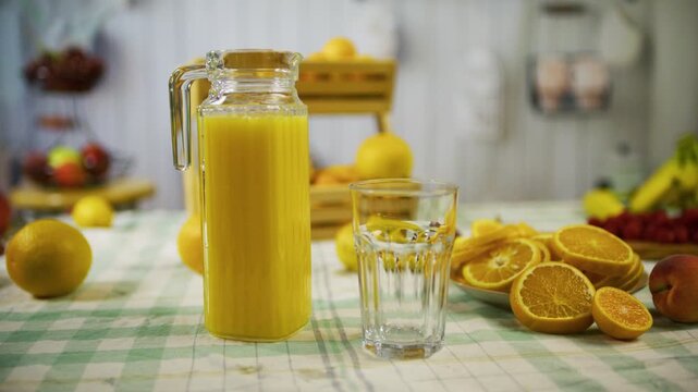 Slow tracking shot of beautiful orange juice display on kitchen counter