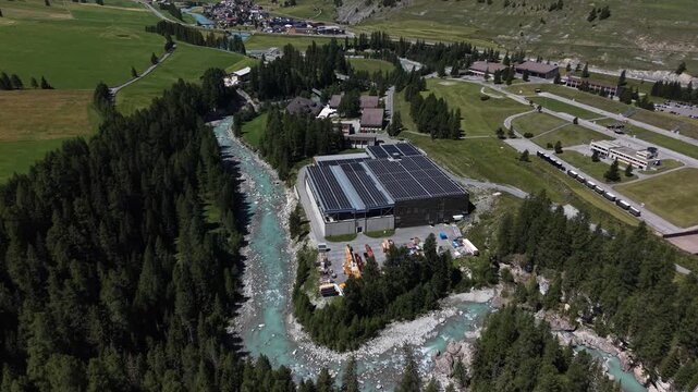 Aerial view of the Upper Engadine wastewater treatment plant situated along the Inn River near S-chanf, Grisons, Switzerland.