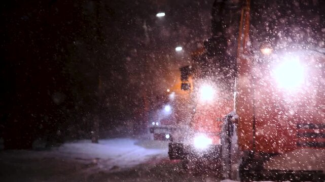 Clearing roads during a winter snowstorm