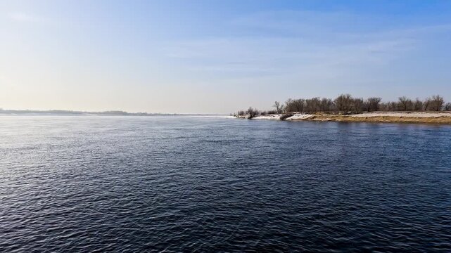 Snow river winter landscape. Frozen ice and snow by river.