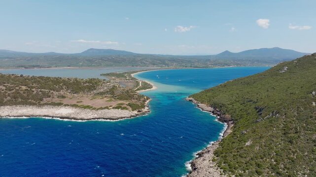 Panoramic drone shot of Sykia and Chrisi Ammos beach near Voidokilia, Pylos, Messinia, Greece. Crystal turquoise water, sunny summer day