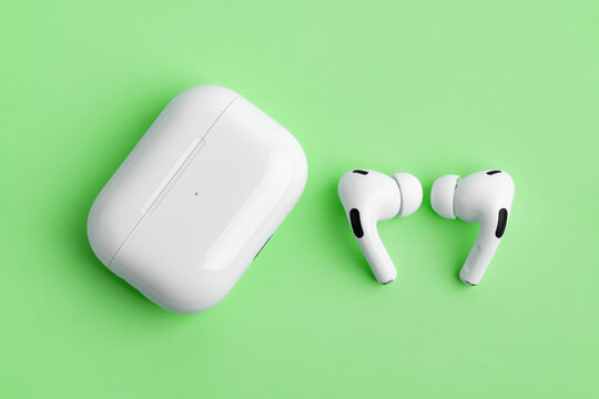 Dnipro, UKRAINE 29.04.2025: Apple AirPods Pro with an open wireless charging case on a bright. High-quality wireless Bluetooth earbuds, iconic consumer electronics product.