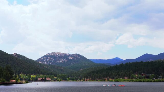Summer Evergreen Lake water sports aerial drone Evergreen Colorado foothills Denver Golf Course paddleboarding canoe kayak boats Front Range Rocky Mountain sunny cloudy morning haze static shot