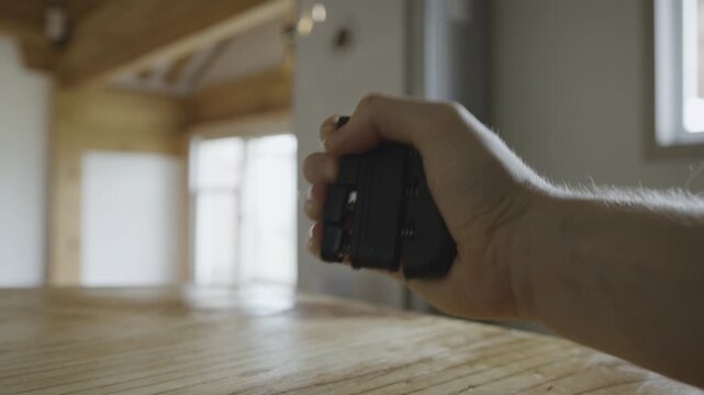 Close-up of a Man&rsquo;s Hand Using a Hand Gripper