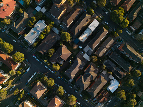 Aerial view of residential neighborhood with houses, rooftops, and tree-lined streets in Northern Beaches, New South Wales, Australia.